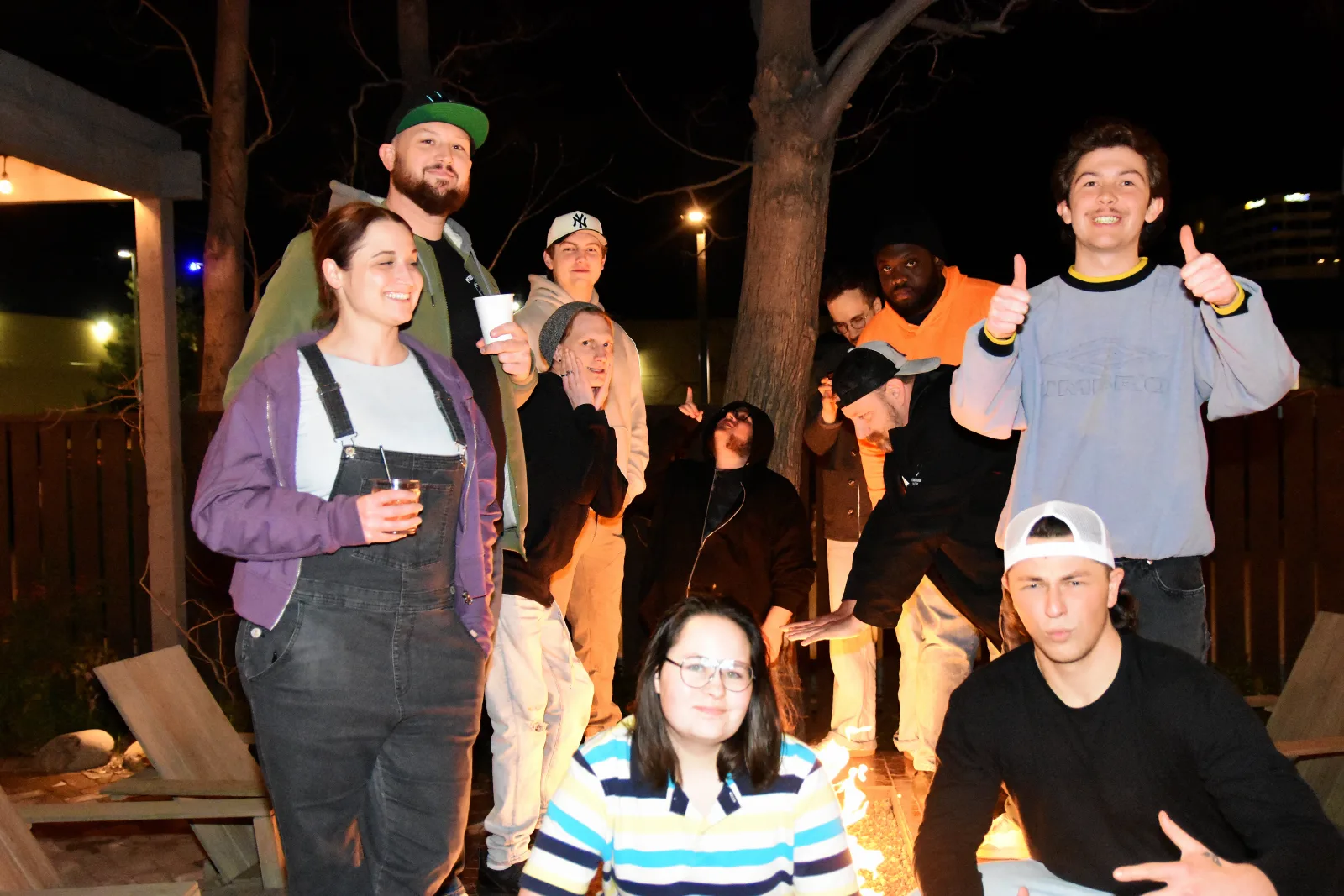 A group of friends spending an evening together outdoors.